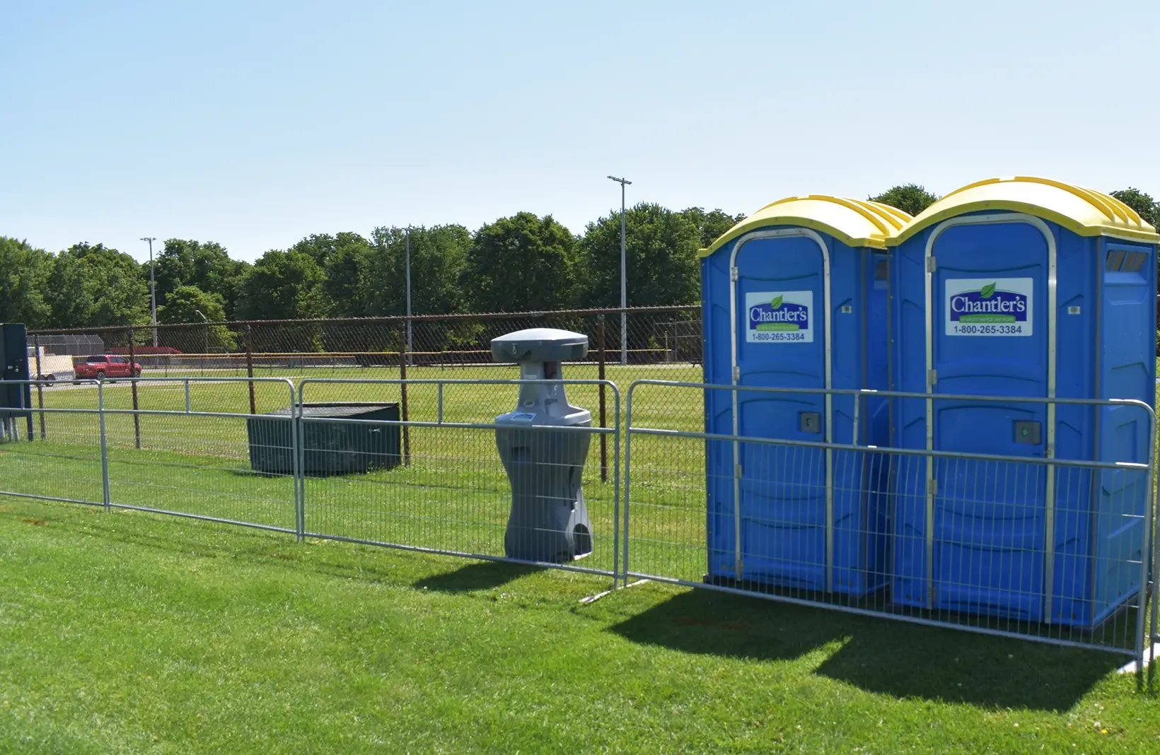 Temporary crowd control barriers creating safe walkways and restricted-access areas for public events
