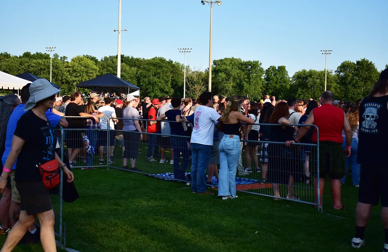 Portable crowd control fencing used to manage pedestrian flow, queue lines, and event perimeters.