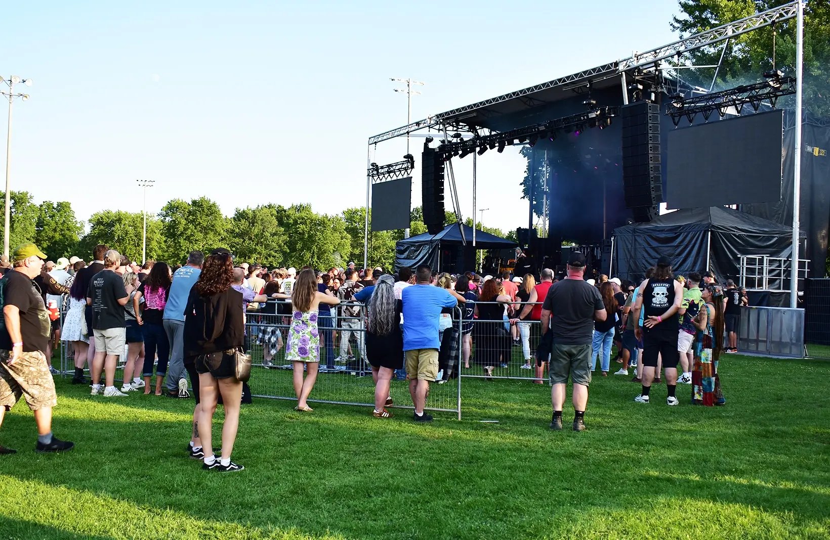 Temporary crowd control barriers creating safe walkways and restricted-access areas for public events