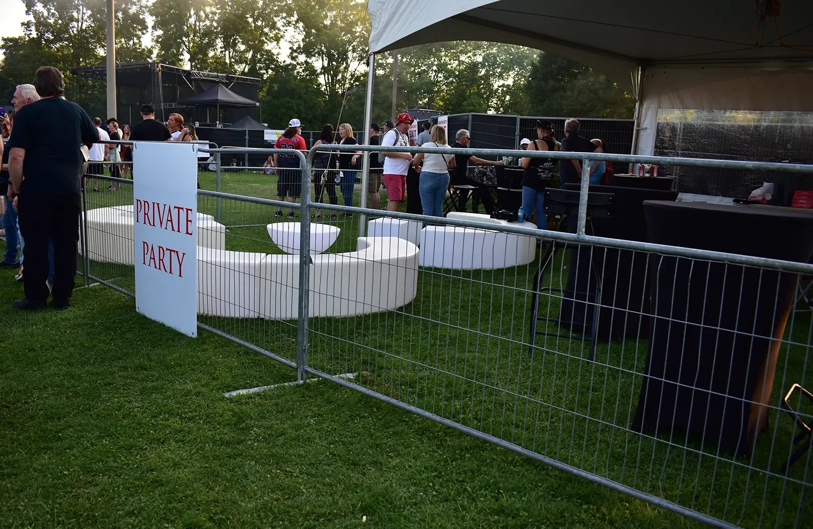 Temporary crowd control barriers creating safe walkways and restricted-access areas for public events