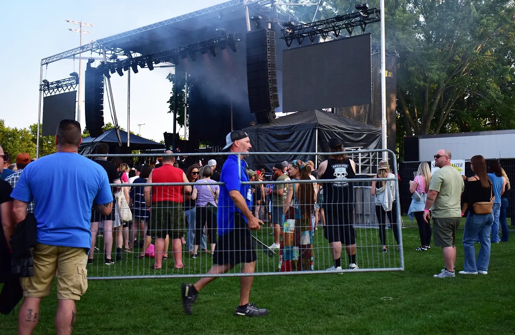 Temporary crowd control barriers creating safe walkways and restricted-access areas for public events