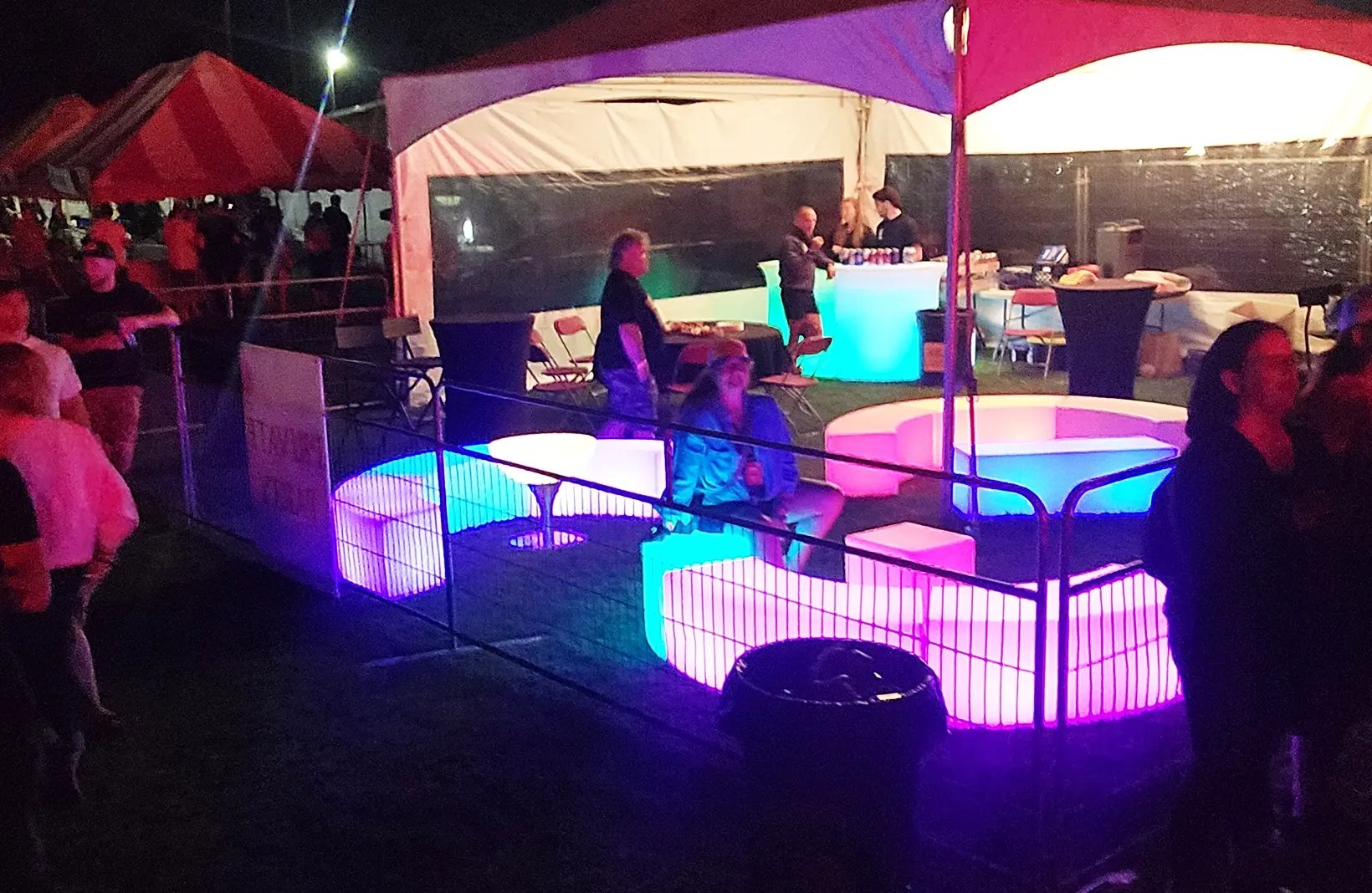 Temporary crowd control barriers creating safe walkways and restricted-access areas for public events