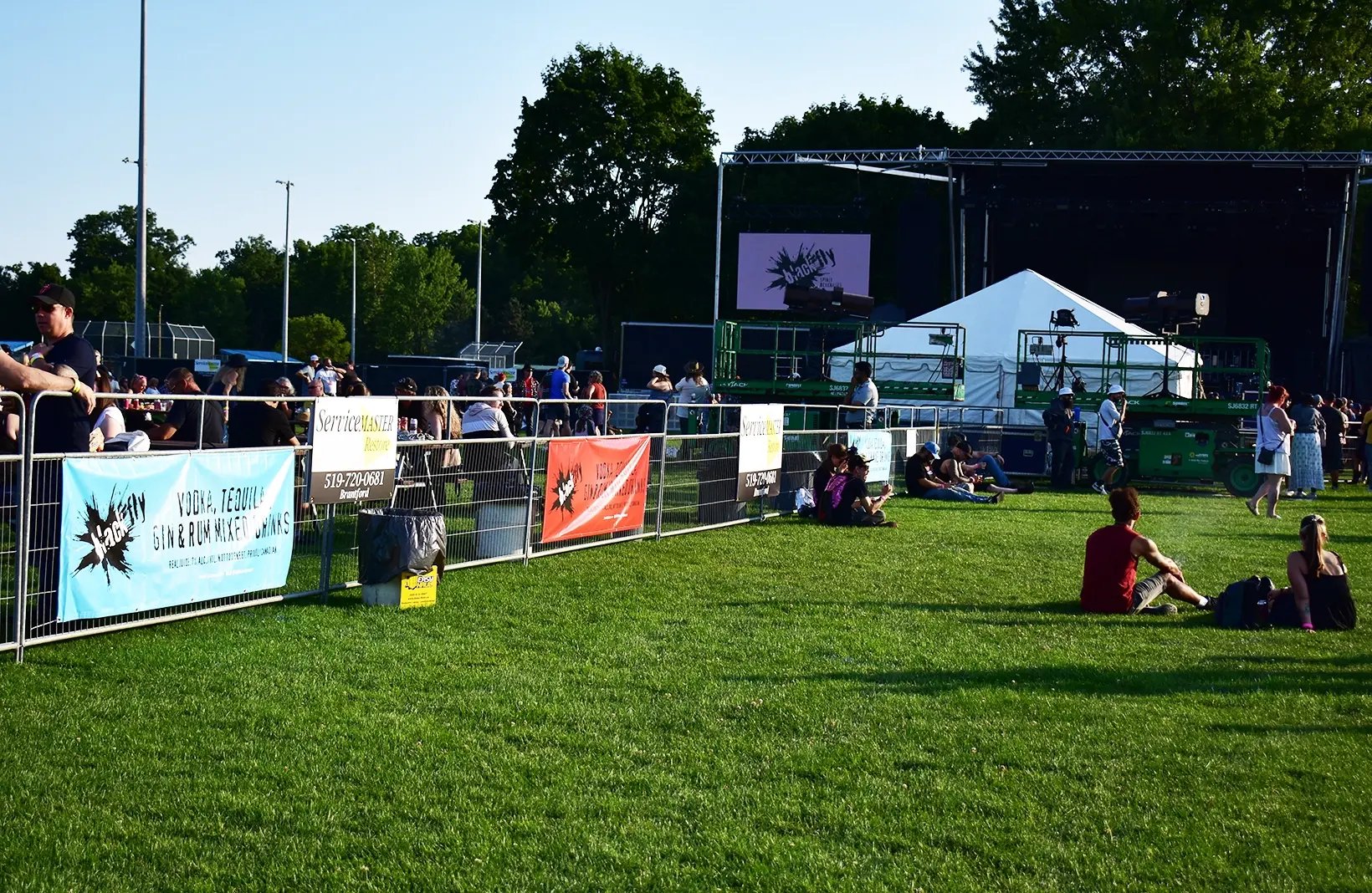 Temporary crowd control barriers creating safe walkways and restricted-access areas for public events